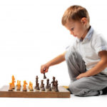 little-boy-playing-chess_102671-3133